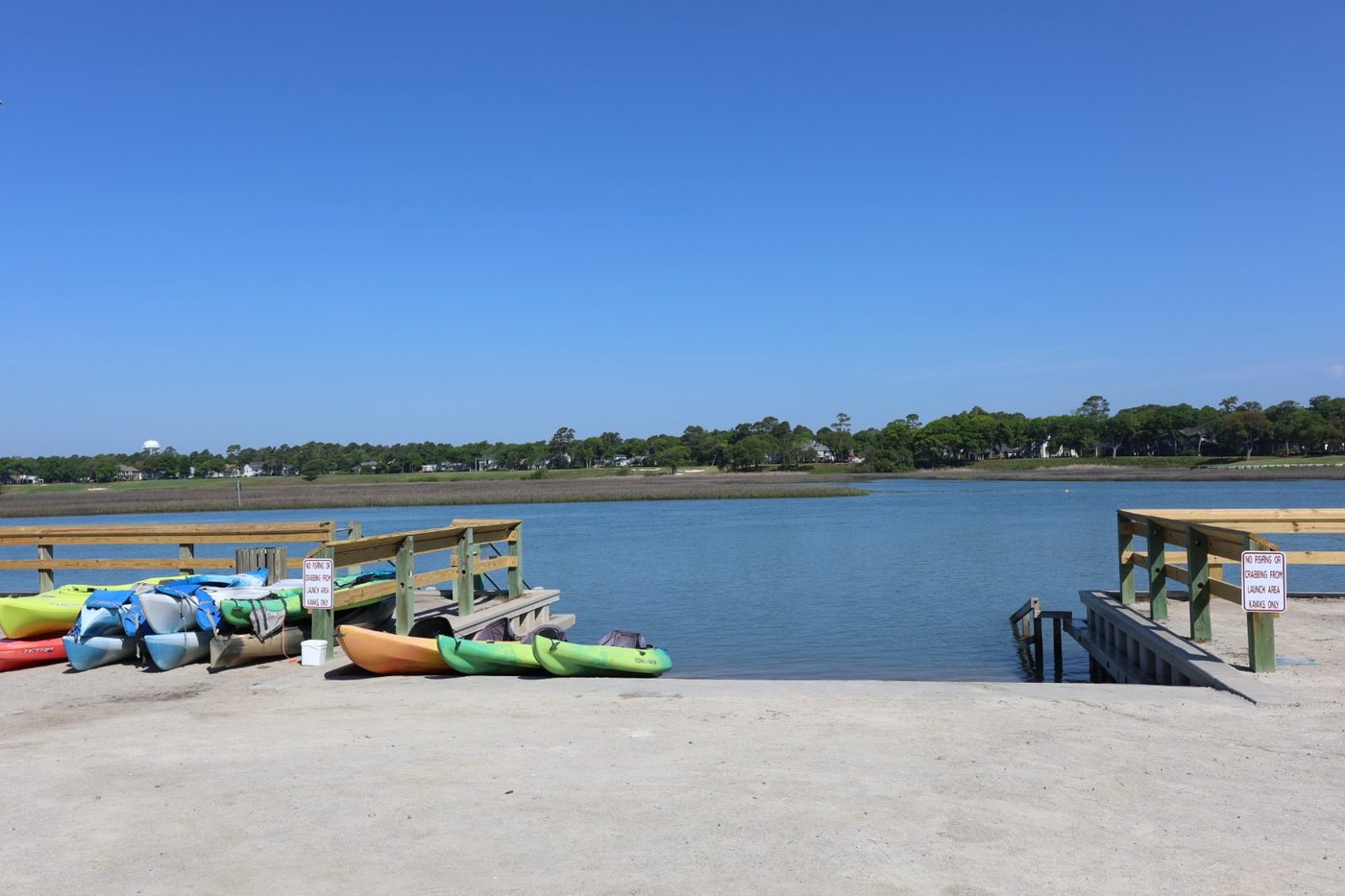 Dedicated kayak launch slip at Cherry Grove Park with colorful kayaks