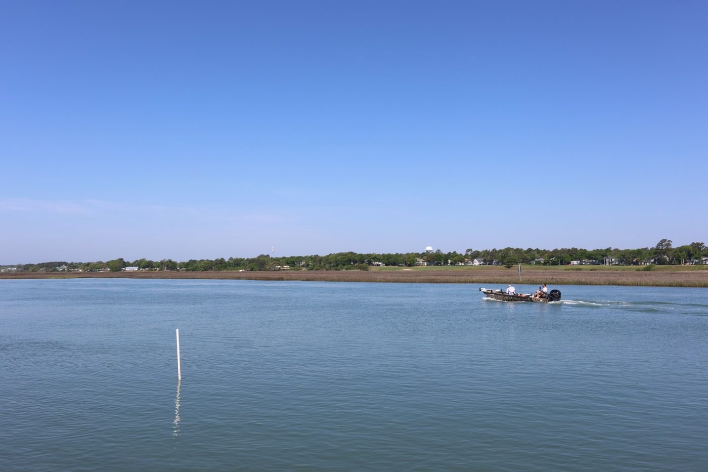 Boat cruising the ICW waterway past Cherry Grove Park