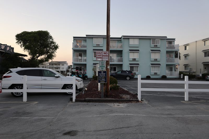 Golf cart parking near the north entrance at Cherry Grove Beach