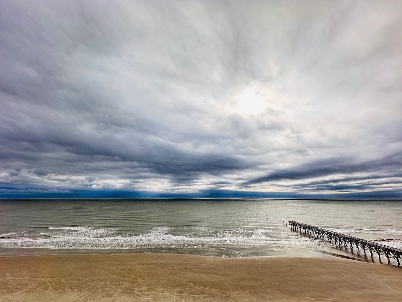 A quiet, cloudy day at Cherry Grove Beach — the kind of day that keeps calling you back